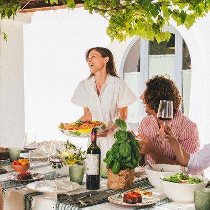 A table laid with Doppio Passo wines and typical Italian dishes.